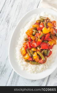 Portion of white rice and caramelized vegetables
