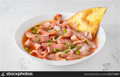 Portion of Yen Ta Fo pink noodle soup