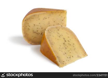 Portions Gouda cumin spiced cheese on white background