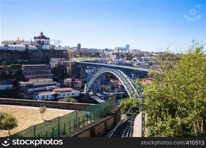 Porto city panorama with Douro River and bridge on a sunny day
