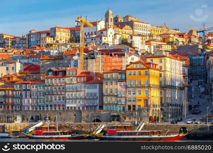 Porto. Multicolored houses on the waterfront of the Douro River.. View of old medieval colorful houses along the Douro River embankment. Porto. Portugal.