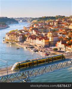 Porto Old Town view and underground train on a bridge. Porto, Portugal