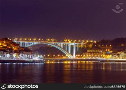 Porto. The car bridge over the Douro River.. A new car bridge over the Douro River in the night illumination. Porto. Portugal.