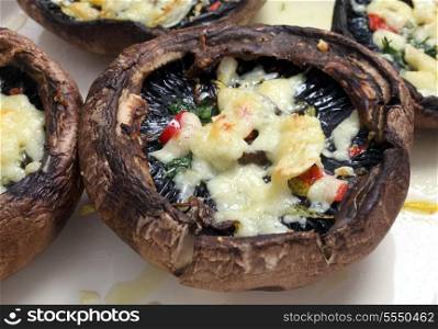 Portobello mushrooms, stuffed with chopped parsley, red chilli,lemon peel and grated cheese, fresh from the oven