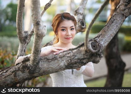 Portrairt of women in white wedding dress at outdoor.