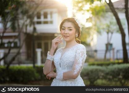 Portrairt of women in white wedding dress at outdoor.
