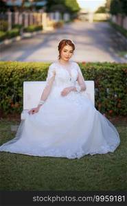 Portrairt of women in white wedding dress at outdoor.