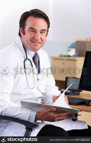 Portrait American doctor sitting at desk