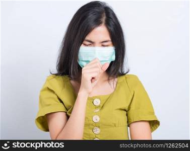 Portrait Asian beautiful happy young woman wearing face mask protects filter dust pm2.5 anti-pollution, anti-smog, and air pollution her sneezing in mask on a white background, with copy space