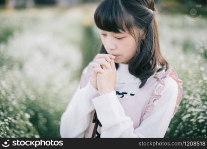 Portrait asian girl with little white flowers background