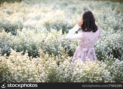 Portrait asian girl with little white flowers background