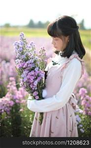 Portrait asian girl with purple flowers background