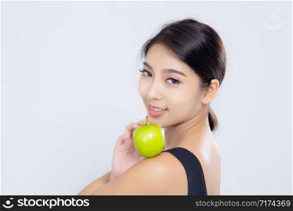 Portrait asian woman smiling holding green apple fruit and beautiful body diet with fit isolated on white background, girl weight slim with cellulite or calories, health and wellness concept.