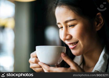 Portrait asian woman smiling relax in coffee shop cafe