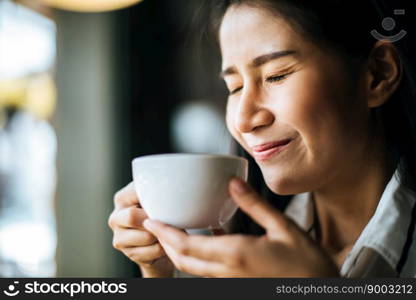 Portrait asian woman smiling relax in coffee shop cafe