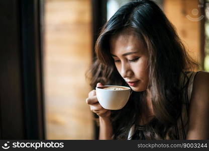 Portrait asian woman smiling relax in coffee shop cafe