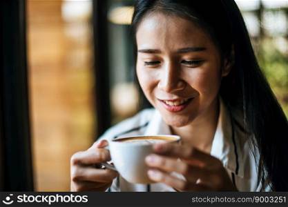 Portrait asian woman smiling relax in coffee shop cafe