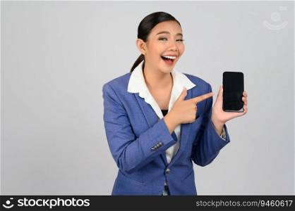 Portrait Asian young woman in officer uniform standing with mobile phone in hand posture, Cheerful girl with happy smiling during use smartphone, isolated on white background