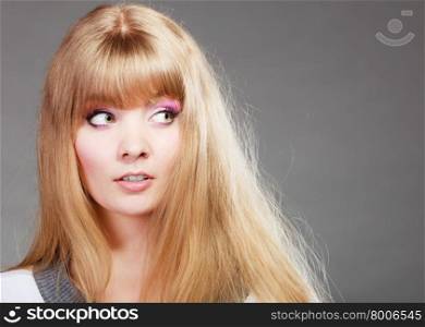 portrait attractive woman face with makeup and long blonde hair