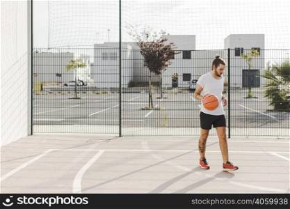 portrait baskeball player standing court