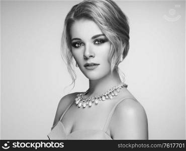 Portrait Beautiful Blonde Woman with Jewelry. Model Girl with Pearl Manicure on Nails. Elegant Hairstyle. Beauty and Fashion Accessories. Perfect Make-Up. Black and White photo