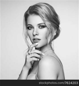 Portrait Beautiful Blonde Woman with Jewelry. Model Girl with Pearl Manicure on Nails. Elegant Hairstyle. Beauty and Fashion Accessories. Perfect Make-Up. Black and White photo