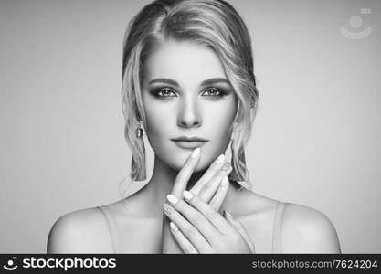 Portrait Beautiful Blonde Woman with Jewelry. Model Girl with Pearl Manicure on Nails. Elegant Hairstyle. Precious Stones and Silver. Beauty and Fashion Accessories. Perfect Make-Up. Black and White photo