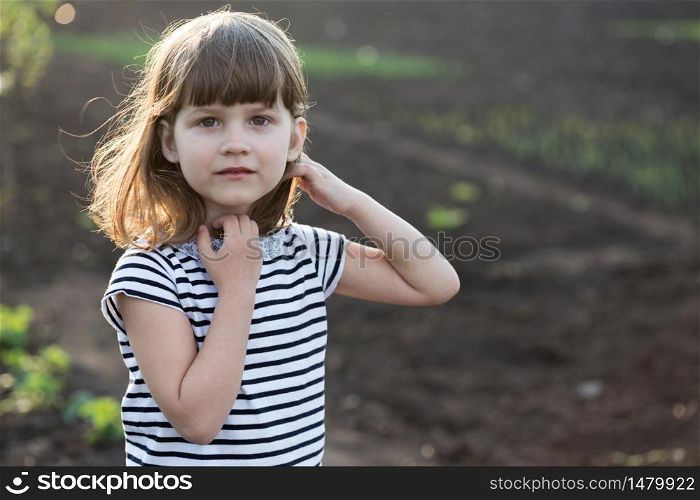 portrait Beautiful little girl in the garden