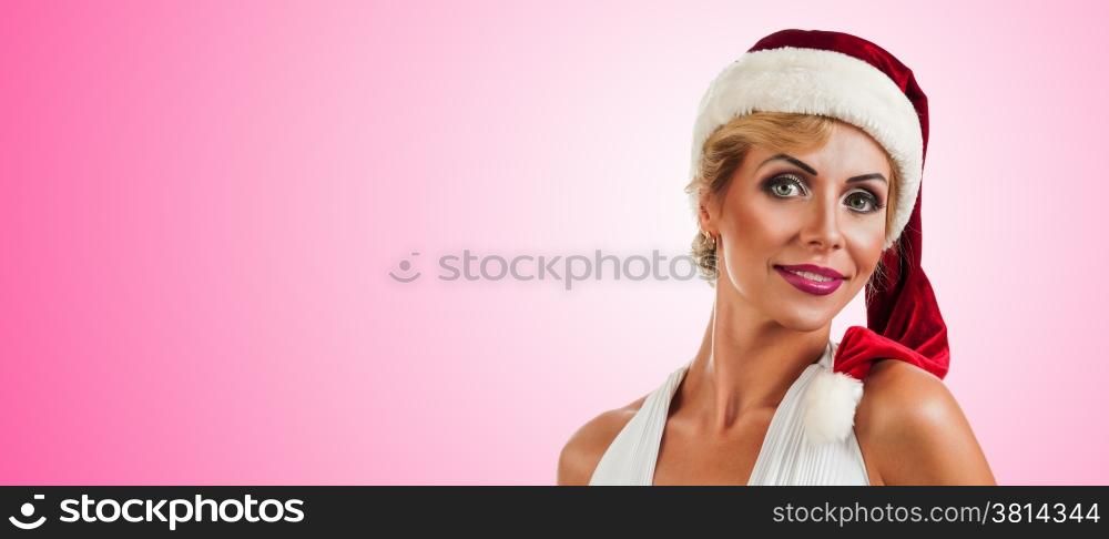 Portrait beautiful smiling woman wearing a santa hat