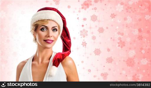 Portrait beautiful smiling woman wearing a santa hat