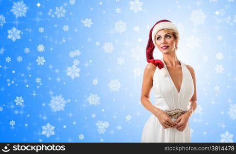 Portrait beautiful smiling woman wearing a santa hat