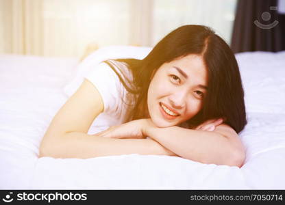 portrait beautiful woman on bed in the bedroom