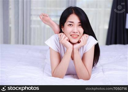 portrait beautiful woman on bed in the bedroom