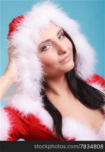 Portrait beautiful woman wearing santa claus costume clothes on blue background