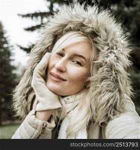 portrait beautiful woman wearing winter jacket with hood