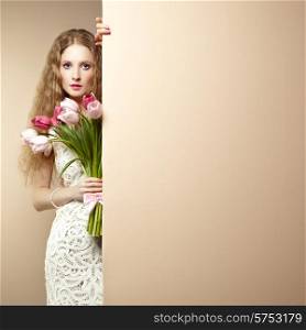 Portrait beautiful woman with bouquet of flowers. Tulips. Blonde girl. March 8. Text background