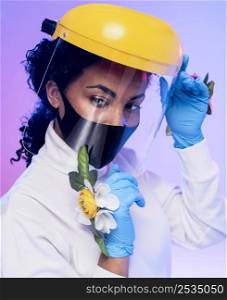 portrait beautiful woman with face shield floral gloves