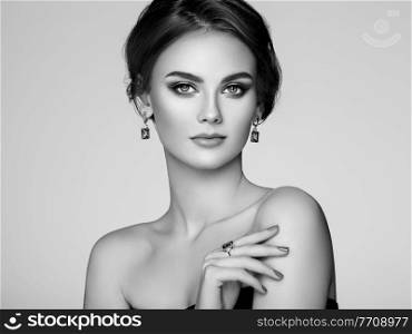 Portrait beautiful woman with jewelry. Model girl with manicure on nails. Beauty and Accessories. Black and white photo