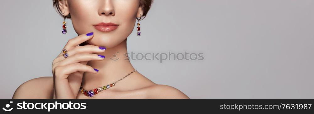 Portrait Beautiful Woman with Jewelry. Model Girl with Violet Manicure on Nails. Elegant Hairstyle. Violet Make-up Arrows. Beauty and Accessories