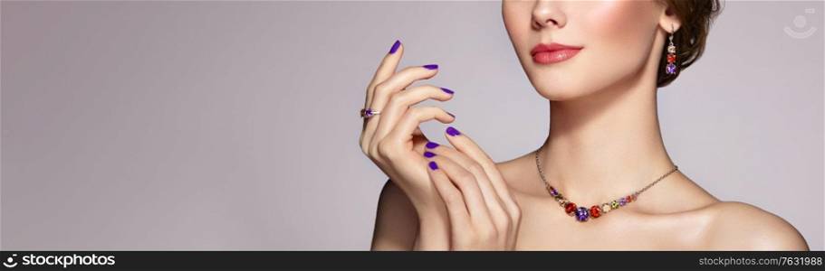 Portrait Beautiful Woman with Jewelry. Model Girl with Violet Manicure on Nails. Elegant Hairstyle. Beauty and Accessories