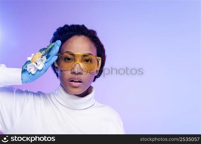 portrait beautiful woman with safety glasses floral gloves