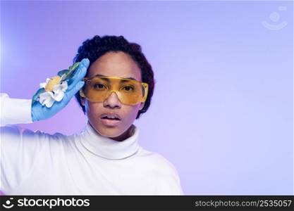 portrait beautiful woman with safety glasses floral gloves
