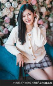 Portrait beautiful young asian woman girl wearing warm clothes at house home in the living room inside or cafe