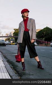 portrait beautiful young woman standing road with bag