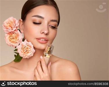 Portrait beautiful young woman with clean fresh skin. Model with foundation makeup bottle. Beautiful young woman with a rose flower