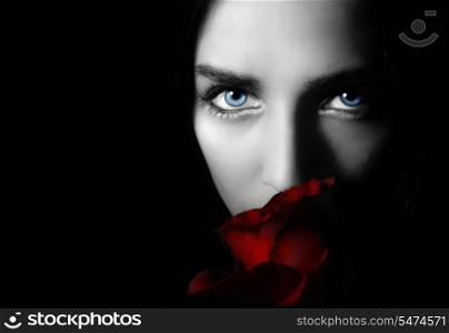 Portrait beauty young woman with rose on a black background