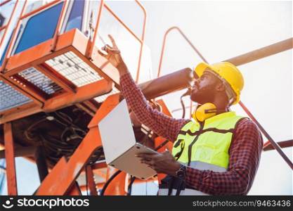 Portrait Black African staff worker happy smile working in cargo crane shipping logistic port.