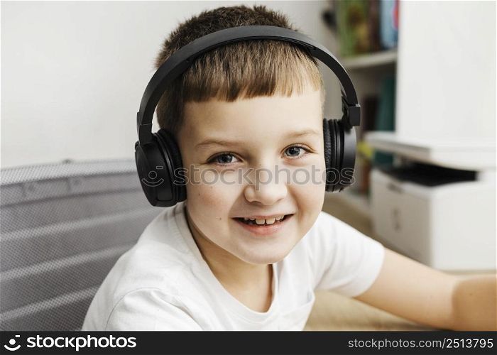 portrait boy wearing computer headphones