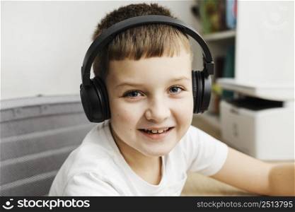 portrait boy wearing computer headphones