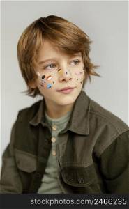 portrait boy with face painted 4
